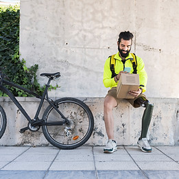 male with prosthetic leg and neon yellow jacket Scanning Delivery Box