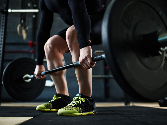 A man lifting weights in a gym
