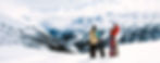 Snowboarders in mountain landscape