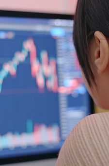 Person Analyzing Graphs On Screen