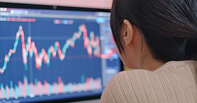 Person Analyzing Graphs On Screen