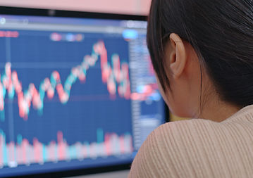 Person Analyzing Graphs On Screen