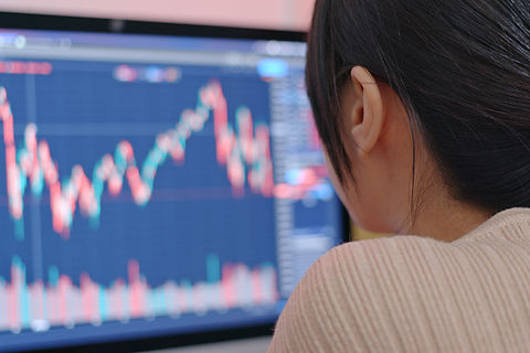 Person Analyzing Graphs On Screen