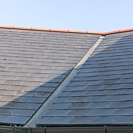 view of a roof with black tiles