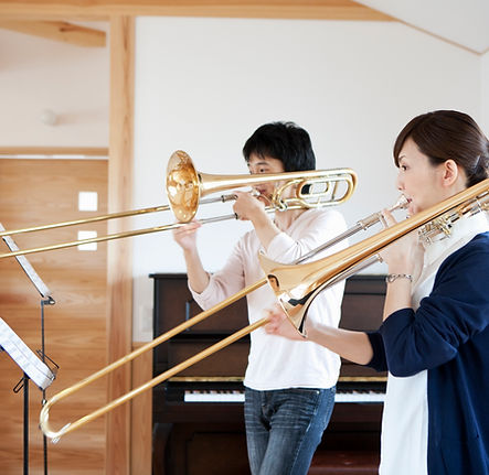 A trombone student with his teacher