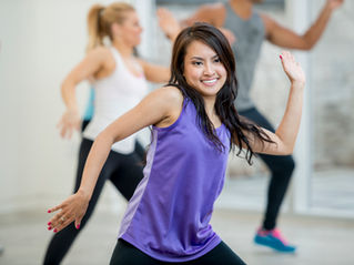 A woman joining a fitness class 