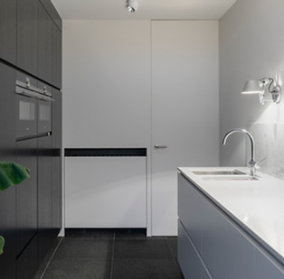 A luxurious modern kitchen with marble countertops and stainless steel appliances in Scottsdale, AZ