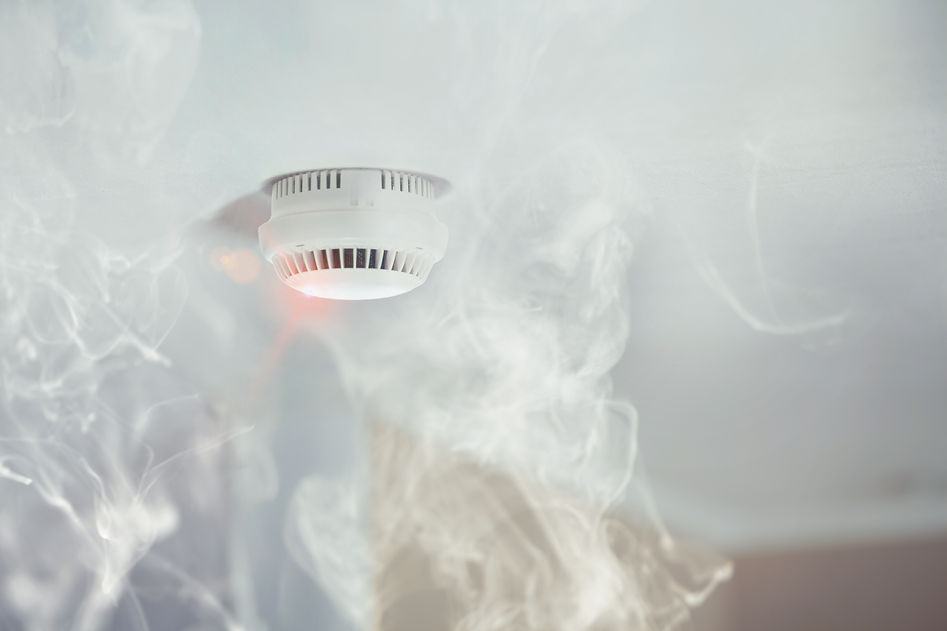 Smoke detector mounted on roof in apartment