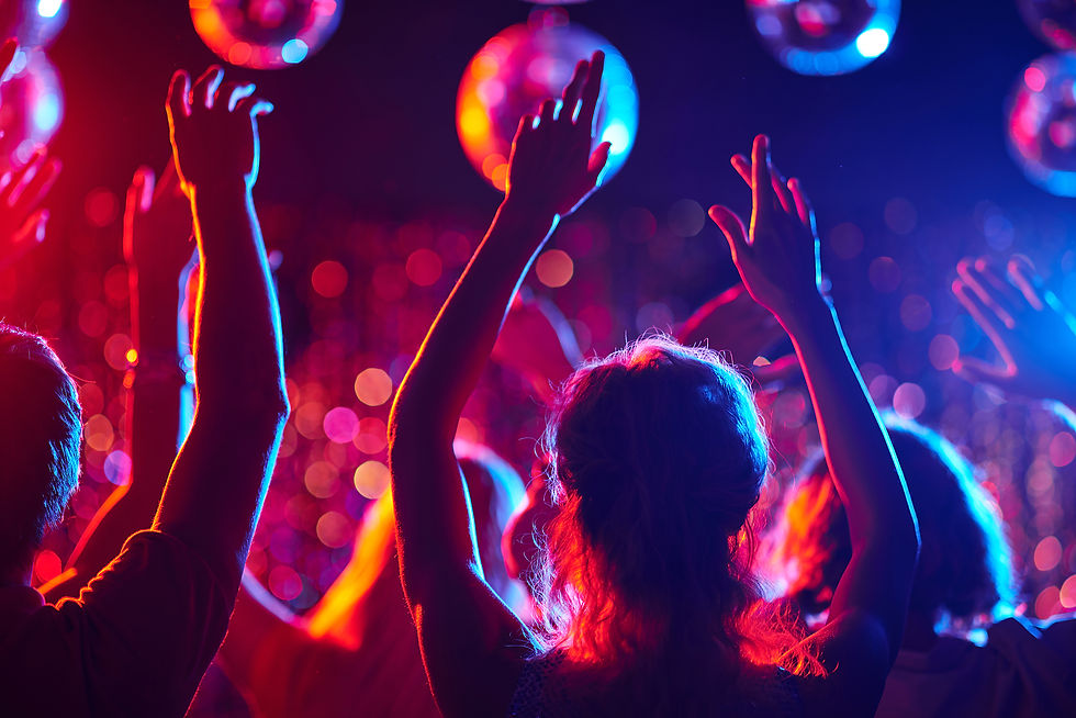 Crowd enjoying vibrant lighting and music at a Wolverhampton night club event