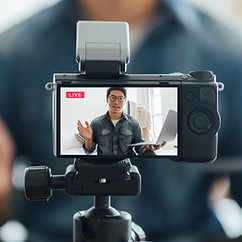 Vlogger looking at camera
