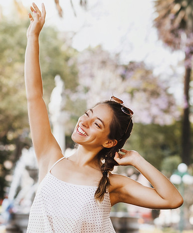 Happy Woman practicing somatic therapy tools
