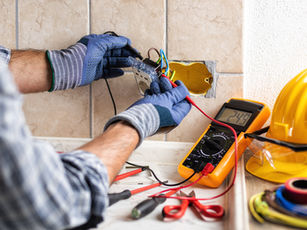 Electrician in gloves tests a wall socket with a multimeter before work — before and after photos