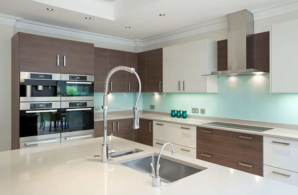 A section of a lovely kitchen in a modern new home featuring a large kitchen island