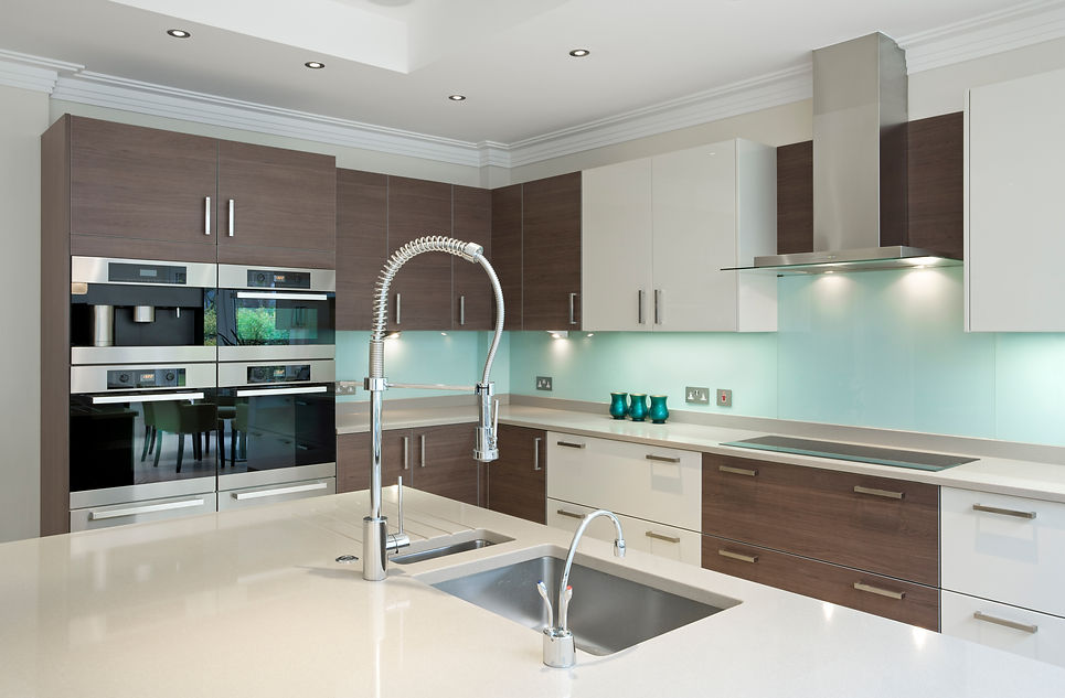 a section of a lovely kitchen in a modern new home featuring a large kitchen island in the