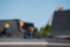 Roofers working on a building