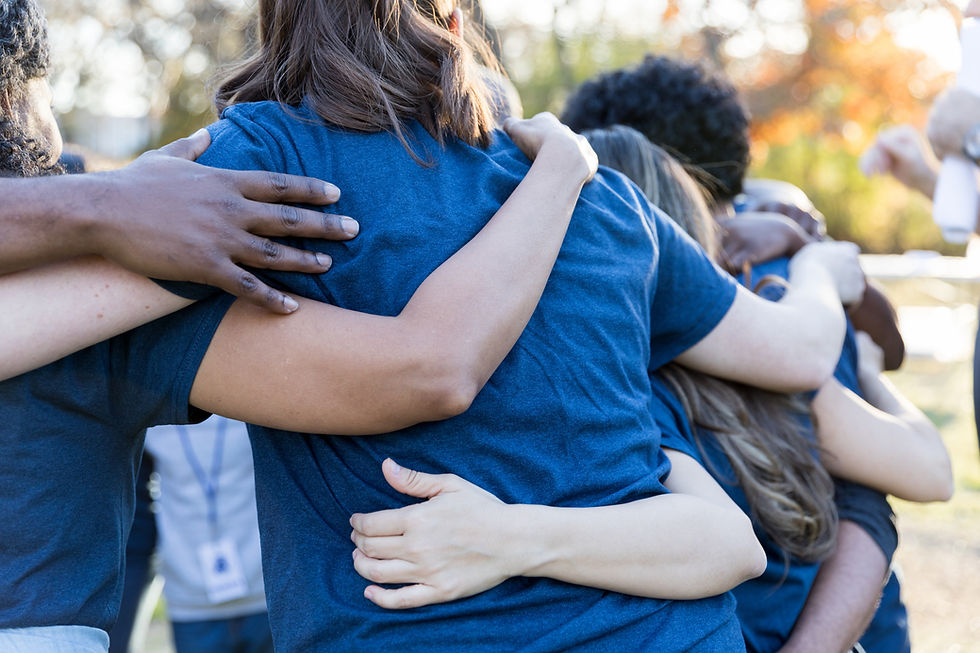 Group Embracing Outdoors