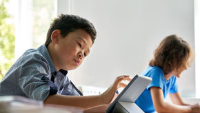 A young boy in a classroom in Hong Kong