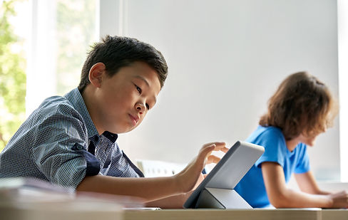 Schoolboy Using Tablet