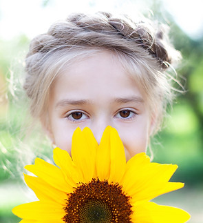 Sunflower Portrait of a girl showcasing SunnyB as a plant based or vegan spread availabel for wholesale purchase