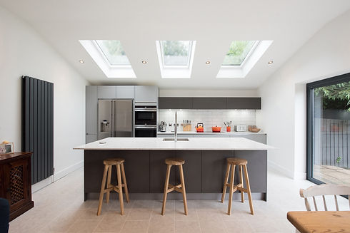 Modern fitted grey kitchen with large island