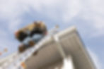 A handyman repairs his rain gutters