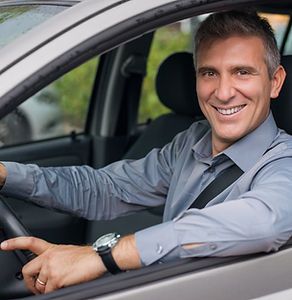 Businessman Driving a Car