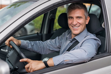Businessman Driving a Car