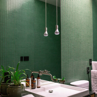 An ensuite with earthy tones and bold tiles.