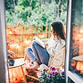Reading a Book in Balcony