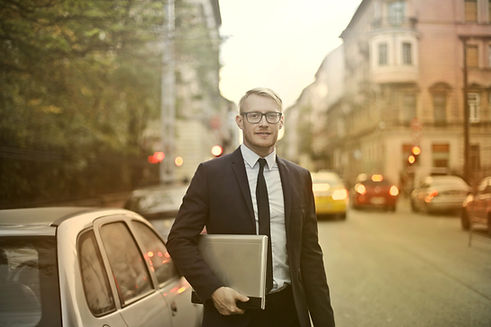 Salesperson with car outside