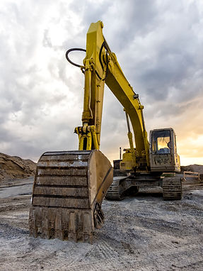 A large yellow excavator with its bucket