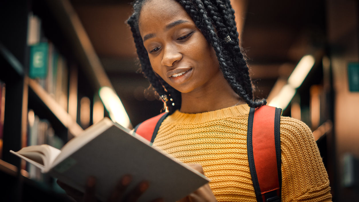 A Young Woman Reading a Book