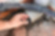 Man´s hand unclogging downpipe of a gutter