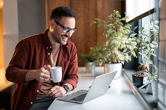 man drinking coffee on online Virtual therapy session for adults in texas accepting insurance