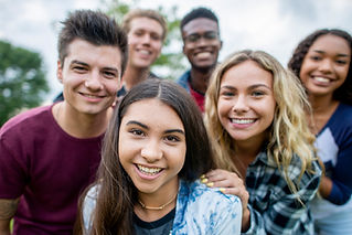 A multi-ethnic group of students smiling