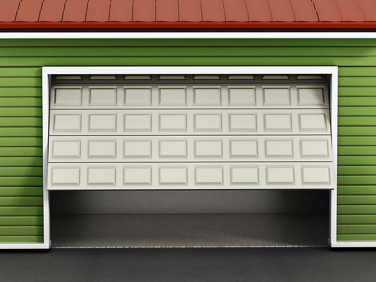 White panel sectional garage door installed against green weatherboard siding