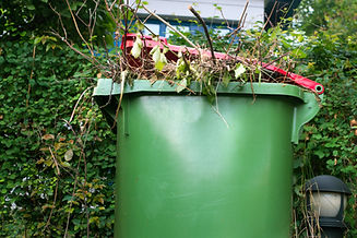 A recycle bin with garden waste