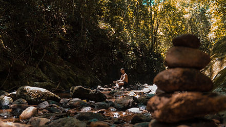 Meditating on rock in the stream