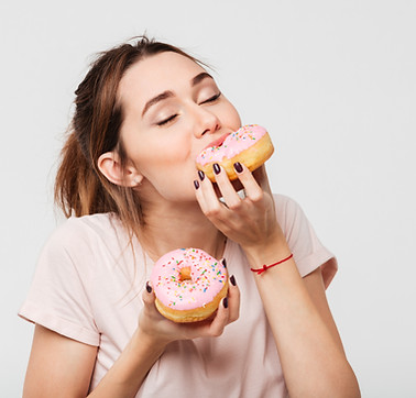 Woman Eating Donuts