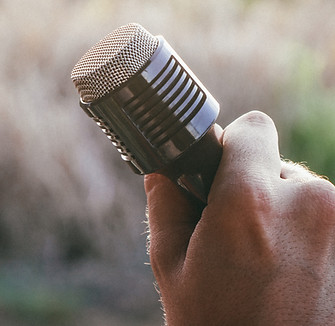Hand Holding Microphone