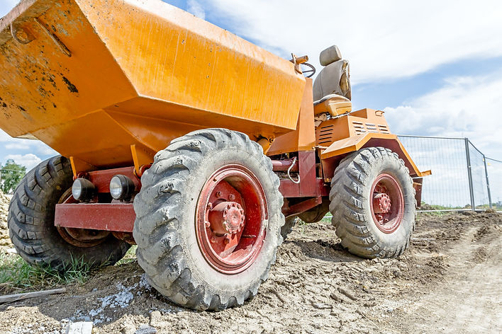 Little construction dumper carrier is at building site