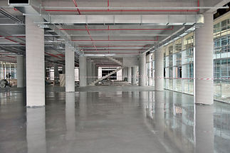 Spacious, modern construction site with concrete floors
