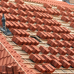 stacks of red tiles on roof