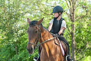 A girl riding a horse