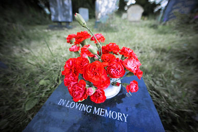 flowers on a grave in a churchyard