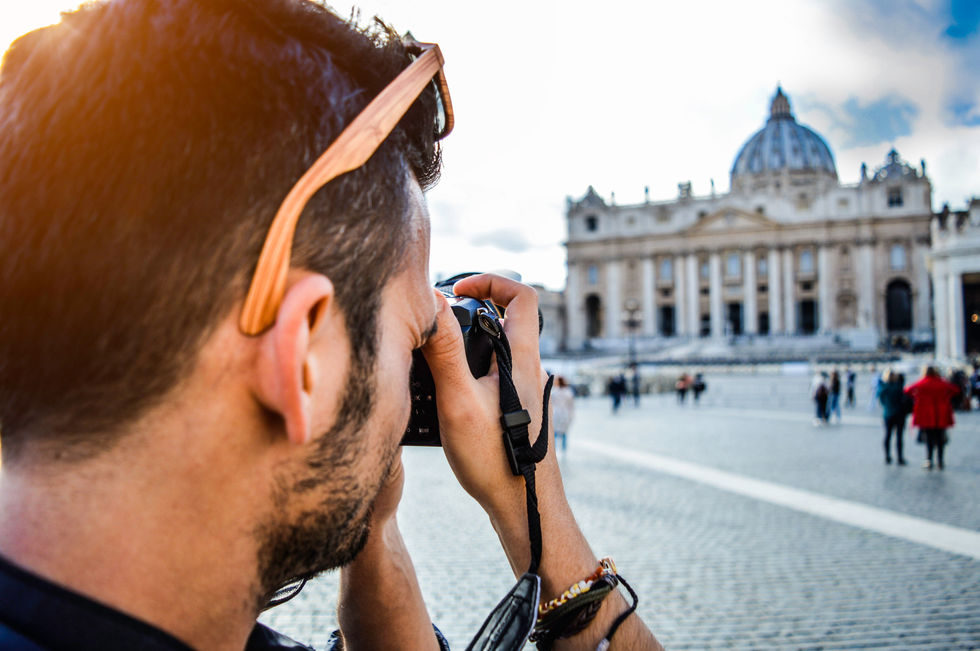 Man Taking Photo of Church
