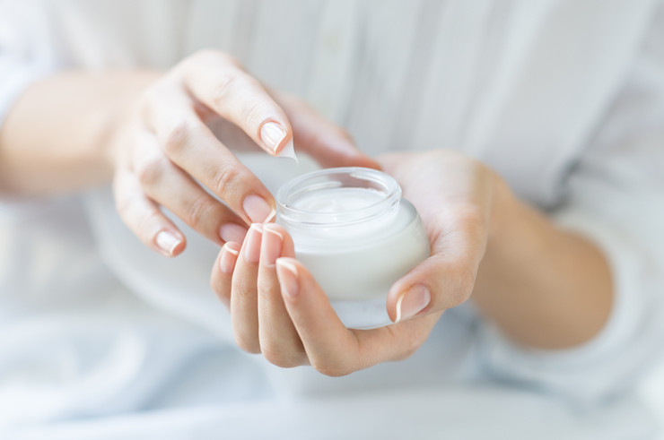 CBD Topicals for Pain. Are they effective? Women with lotion