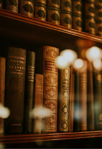 Antique Books on Wooden Shelf