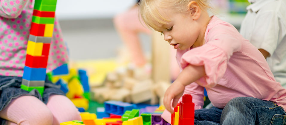 Child playing with colorful blocks