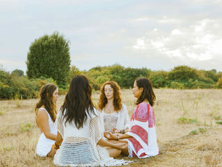 Four people sitting in a circle meditating. Peaceful protest guided imagery worksheet for nervous system grounding.